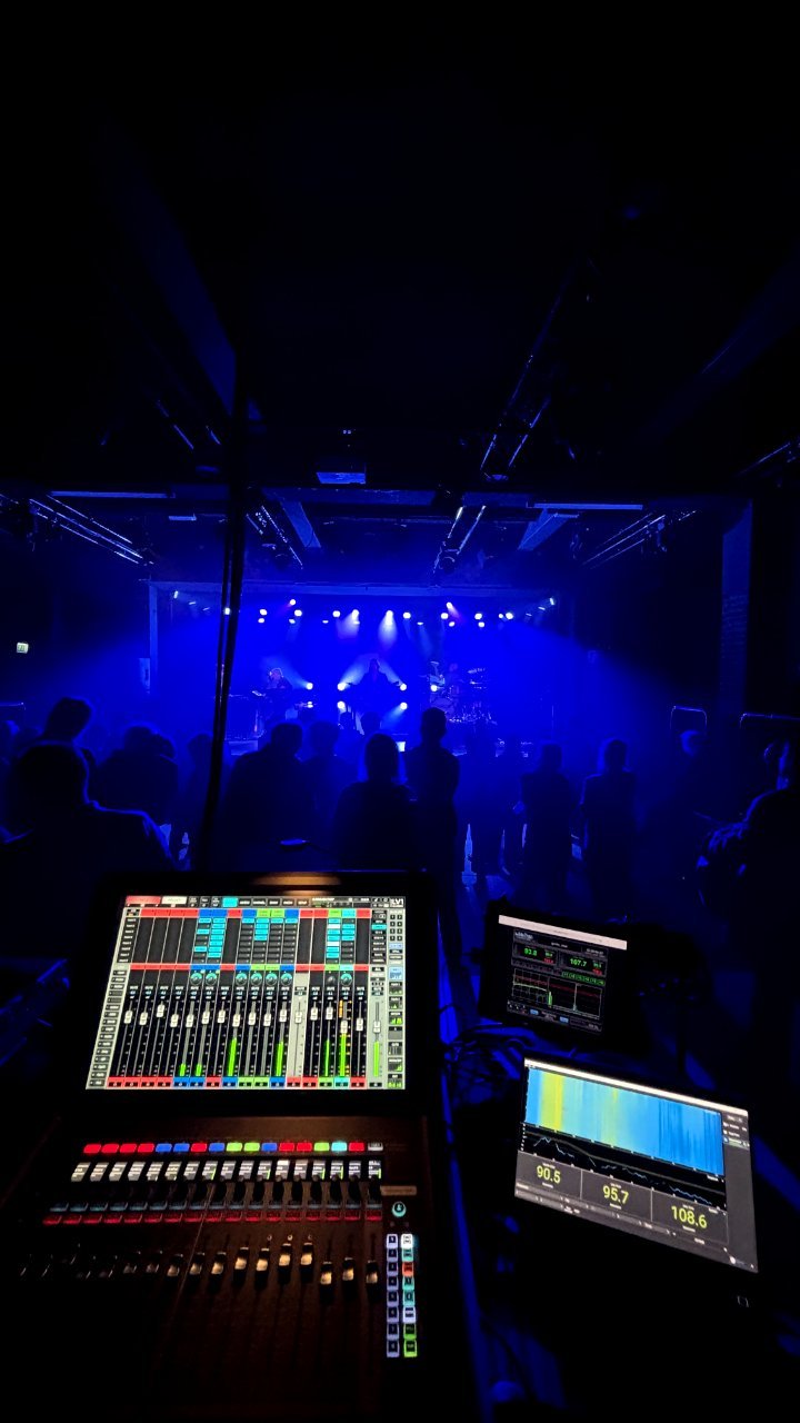 Blue-lit venue from the mix position
